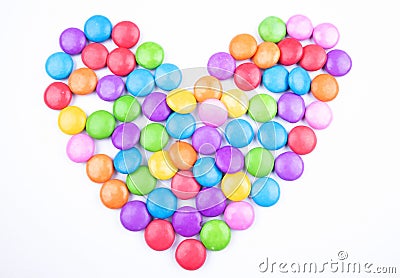 Heart filled with gems or colour chocolate candies Stock Photo