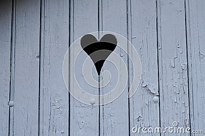 Heart on gey door wooden background Stock Photo