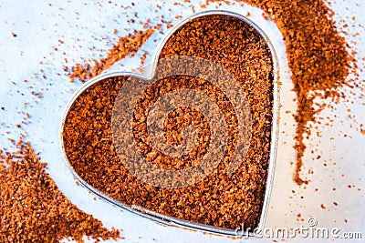 Ground Cayenne Pepper in a Heart Shape Stock Photo