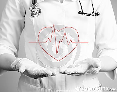 Heart with heartbeat rhythm over doctor hands in gloves. Electrocardiogram test conducting, checking for heart problems Stock Photo