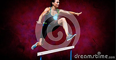 Heart icon over caucasian female athlete jumping over hurdle against grunge effect on red background Stock Photo