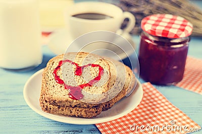 Heart of jam on a toast, with a cross-process effect Stock Photo