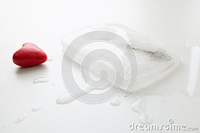 Heart and key frozen in a block of ice Stock Photo