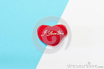 The heart is laid on two-color paper with blue and white overlapping.Minimal concept. Flat lay background Stock Photo