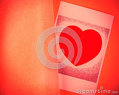 Heart lies on orange background Stock Photo