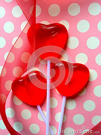 Heart lollipops on polka dots Stock Photo