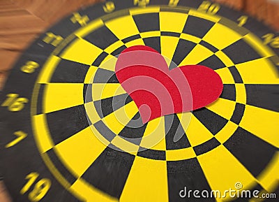 The heart of love is the target of the dart Stock Photo