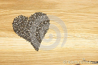 Heart made of black chia seeds Stock Photo