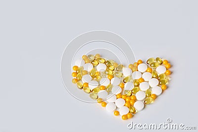 Heart made of different medicaments. Isolated on white background. Stock Photo