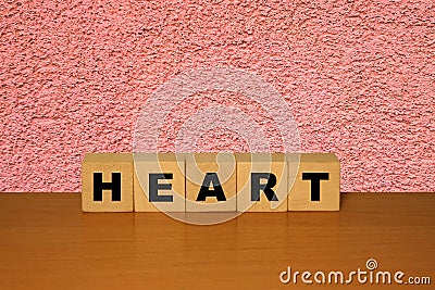 HEART message word on a wooden desk on cube blocks Stock Photo