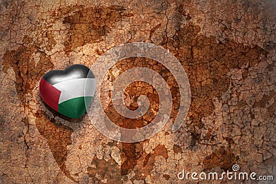 Heart with national flag of palestine on a vintage world map crack paper background. Stock Photo