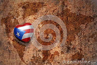 Heart with national flag of puerto rico on a vintage world map crack paper background. Stock Photo