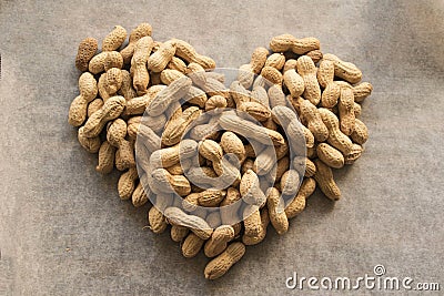 Heart of not peeled peanuts Stock Photo