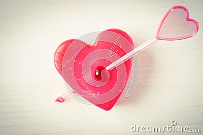 Heart pierced by an arrow Stock Photo