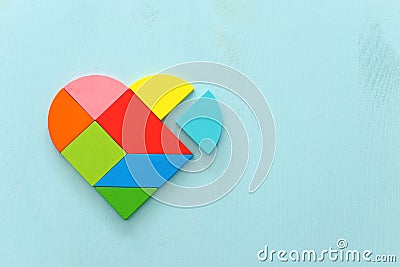 Heart puzzle on blue pastel wooden background Stock Photo