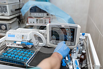 Heart rate monitor in hospital theater. Medical vital signs monitor instrument in a hospital on anesthesia surgery monitor. ECG Editorial Stock Photo