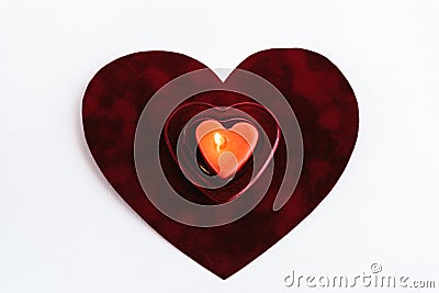 Heart red candle on velvet isolated on white background, valenti Stock Photo