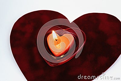 Heart red candle on velvet isolated on white background, valenti Stock Photo