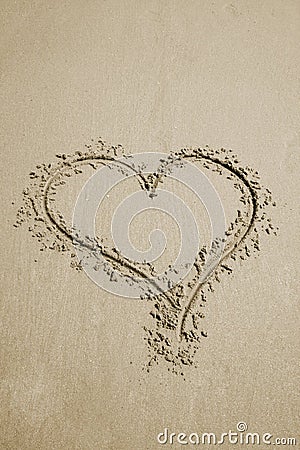 Heart in sand Stock Photo