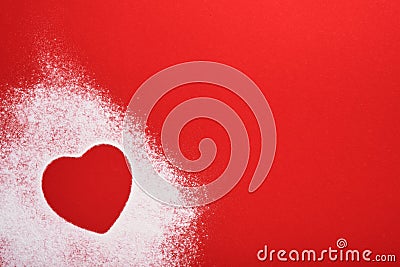 Heart shape frame made of flour on red background. Happy Valentines day, mothers day. Valentines day gift bakery concept for card Stock Photo