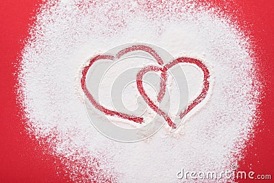 Heart shape frame made of flour on red background. Happy Valentines day, mothers day. Valentines day gift bakery concept for card Stock Photo