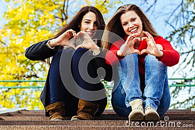 Heart shape from friends hands Stock Photo