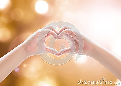 Heart-shape hand gesture of kid`s body language for children`s love, peace, kindness and world humanitarian aid concept Stock Photo