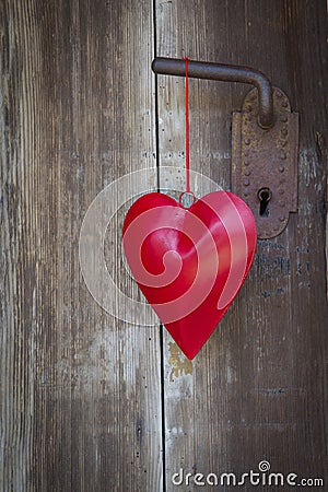 Heart shape hanging on door handle for valentine, christmas, wed Stock Photo