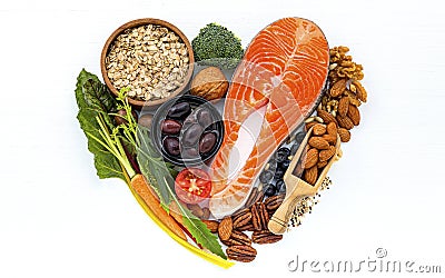 Heart shape of ingredients for healthy foods selection on white wooden background Stock Photo