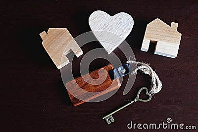 Heart shape key with wooden home keyring, wooden heart model and house figure decoration, sweet home concept Stock Photo