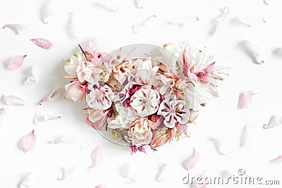 Heart shape made of flowers on white background Stock Photo