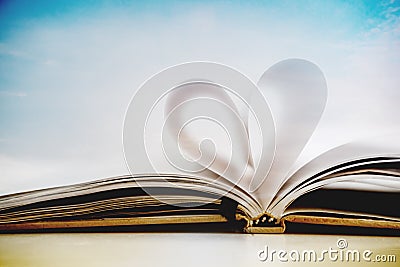 Heart shape on opened notebook page, vintage colors toned Stock Photo