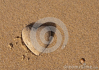 Heart shape of the sand - a symbol of love Stock Photo