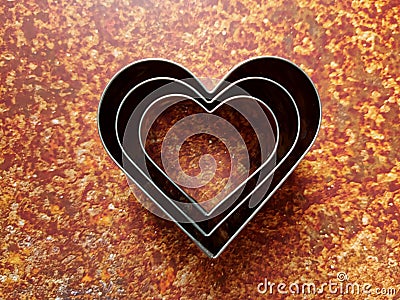 Heart-shaped aluminum for making cookies. Stock Photo