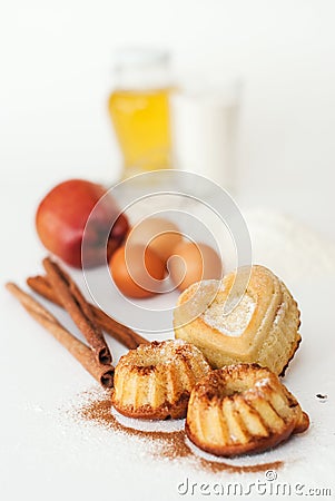 Heart-shaped cake and ingredients Stock Photo