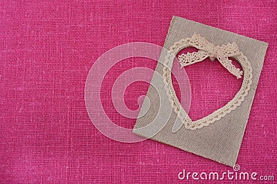 Heart shaped canvas frame on pink canvas Stock Photo