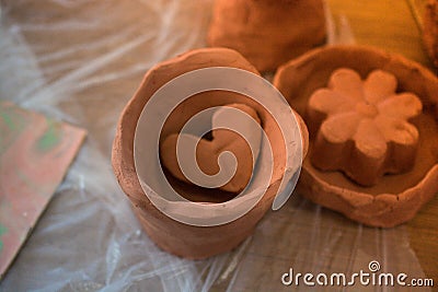 Heart shaped clay object in view Stock Photo