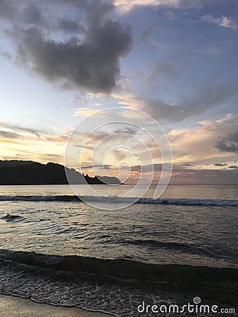 Heart Shaped Cloud during Purple Sunset in Hanalei Bay on Kauai Island in Hawaii. Stock Photo