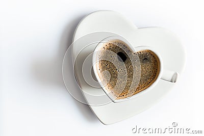 Heart shaped cup of black coffee on white. Love Stock Photo