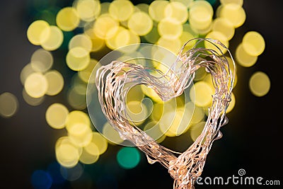 Heart shaped holiday blurred bokeh background. Valentine background. Christmas background. Horizontal Stock Photo