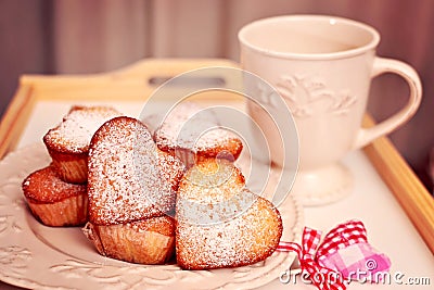 Heart shaped muffins in vintage plate Stock Photo