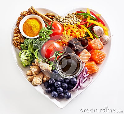 Heart-shaped plate of healthy heart foods Stock Photo