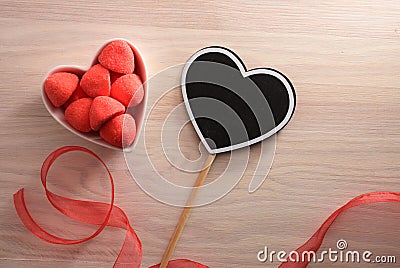 Heart poster and containre with sweets in top view Stock Photo