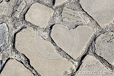 Heart shaped rock on the ground in the park Stock Photo