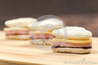 Heart shaped sandwich recipe, ingredients with sauces on a wooden board. Close up, selective focus Stock Photo