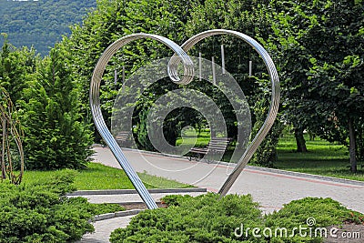 Heart shaped sculpture for all lovers. Inscription: to all lovers. Russia, Krasnodar region, Novorossiysk district, Abrau-Durso vi Editorial Stock Photo