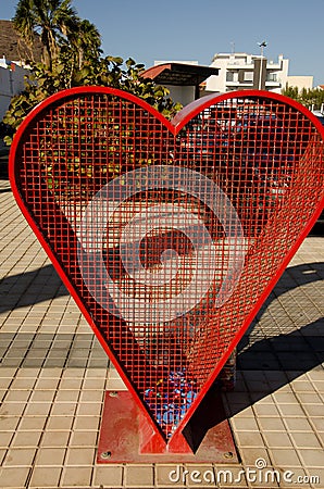 Heart-shaped structure to deposit plastic caps. Stock Photo