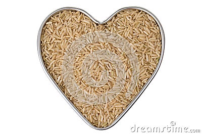 Heart shaped tin pan full of raw Thai half polished Brown Jasmine rice grains, isolated on white Stock Photo