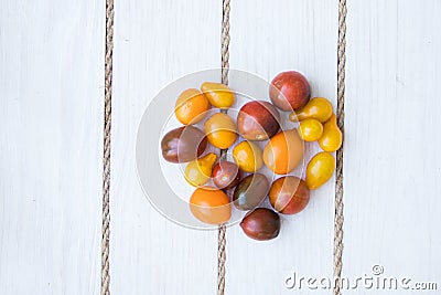 Heart shaped tomatoes. white wood background. soft focus. top view Stock Photo