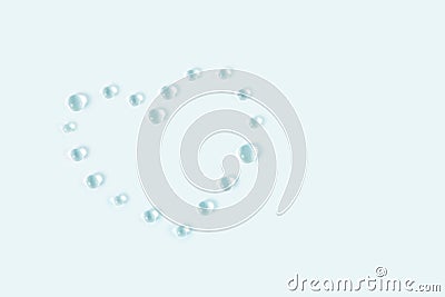 Heart shaped transparent water drops. Light delicate blue tone background Stock Photo